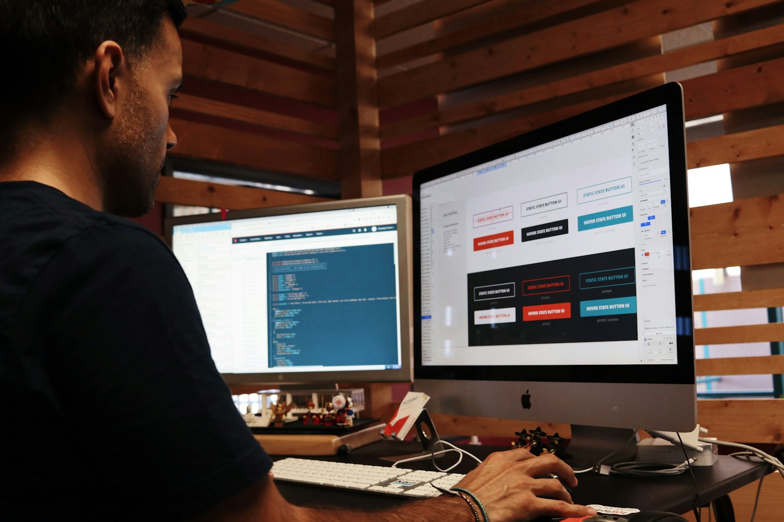 Designer building a website at a workstation